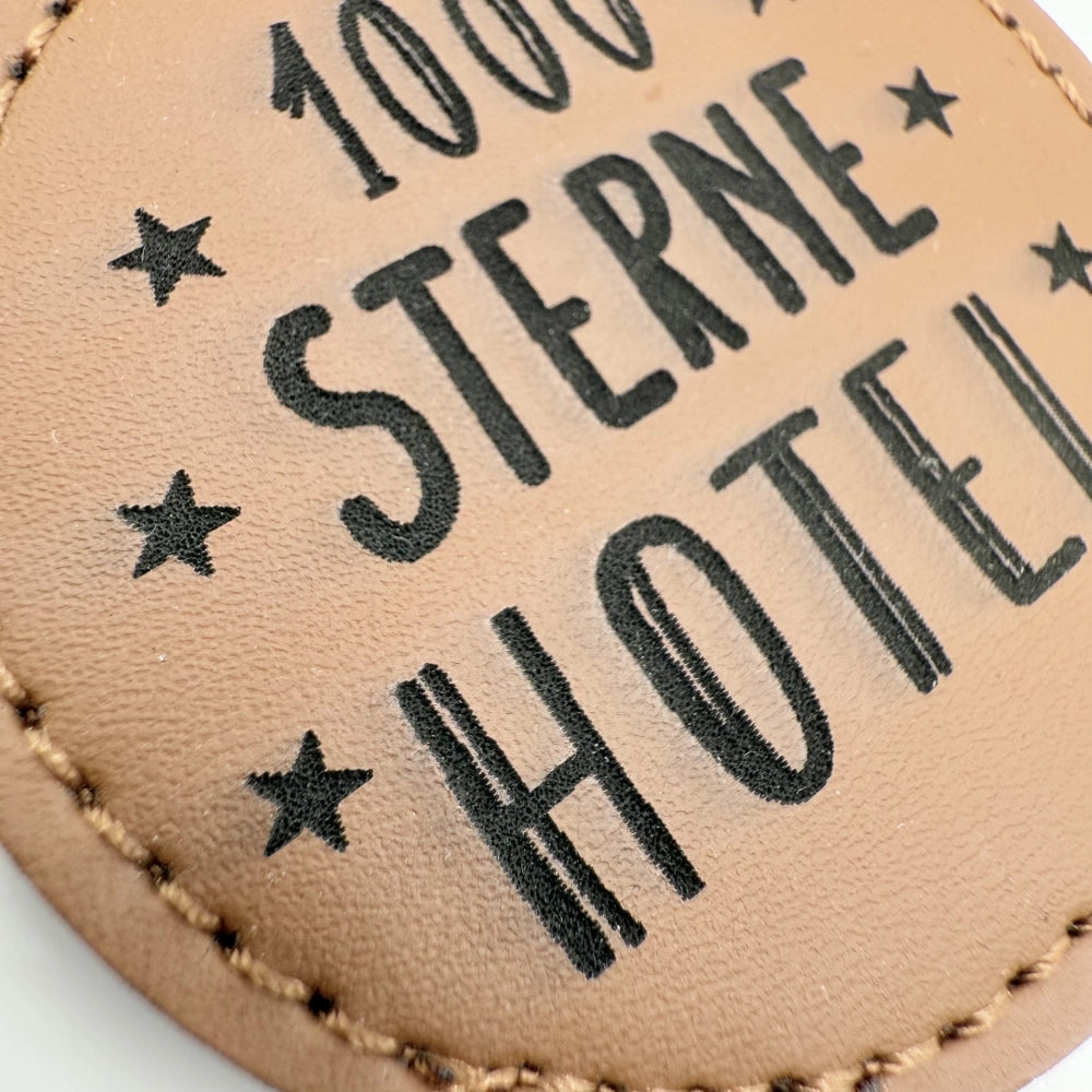 Runder Schlüsselanhänger mit Fach für Chip "1000 Sterne Hotel"