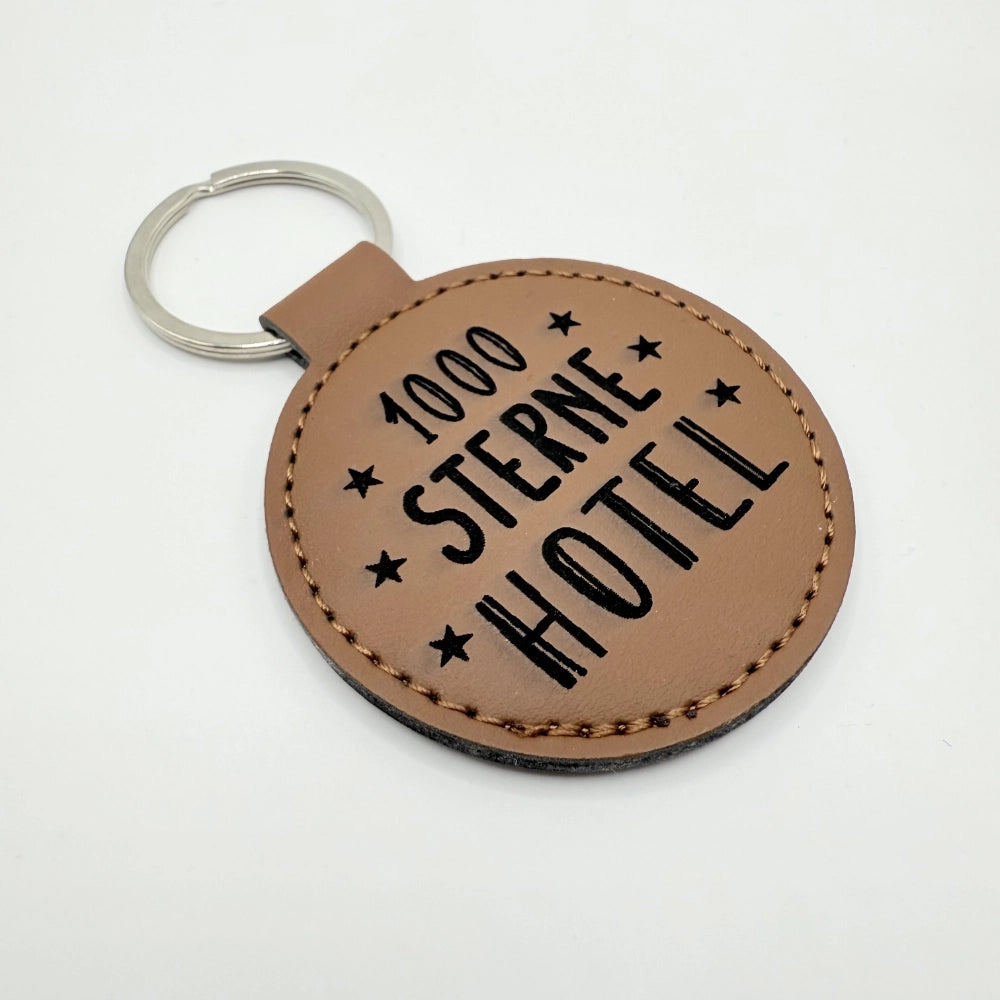 Runder Schlüsselanhänger mit Fach für Chip "1000 Sterne Hotel"