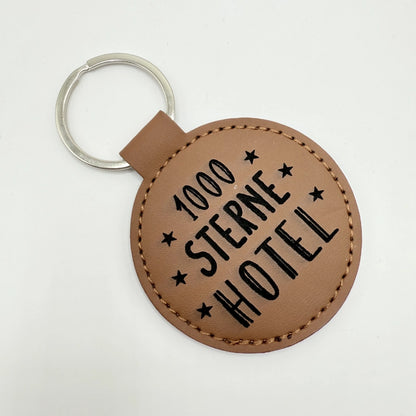 Runder Schlüsselanhänger mit Fach für Chip "1000 Sterne Hotel"